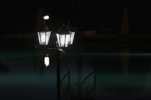 Streetlight at night near the pool