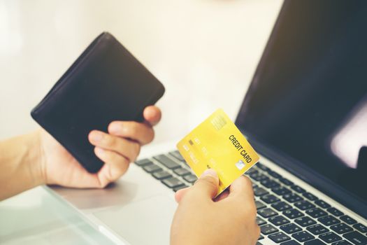 Women use credit card to shopping online at her home