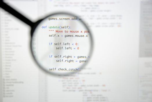 Real Python code developing screen. Programing workflow abstract algorithm concept. Lines of Python code visible under magnifying lens.