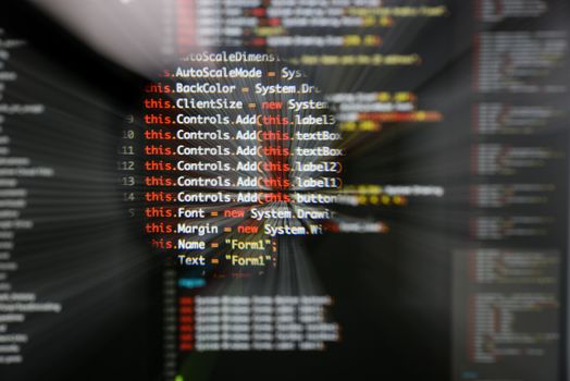 Real c# code developing screen. Programing workflow abstract algorithm concept. Lines of c# code visible under magnifying lens  with moviment effect.