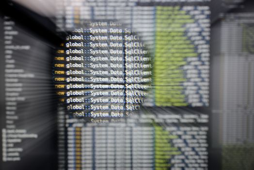 Real c# code developing screen. Programing workflow abstract algorithm concept. Lines of c# code visible under magnifying lens  with moviment effect.