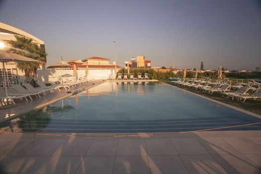 Resort pool empty at sunset time