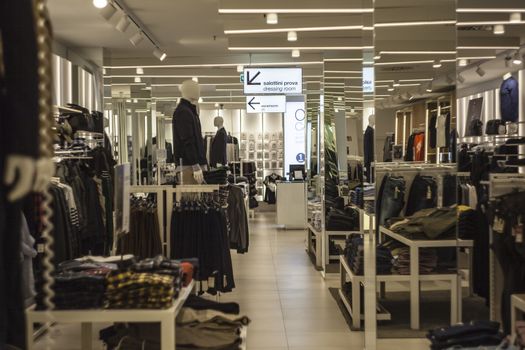 Interior of a clothing store with many tipes of dresses