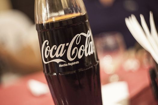 Glass Bottle of coca cola during the dinner