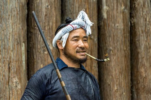 A Basha Miao Man in the Basha Miao Village of the  Congjiang county, Guizhou of China.