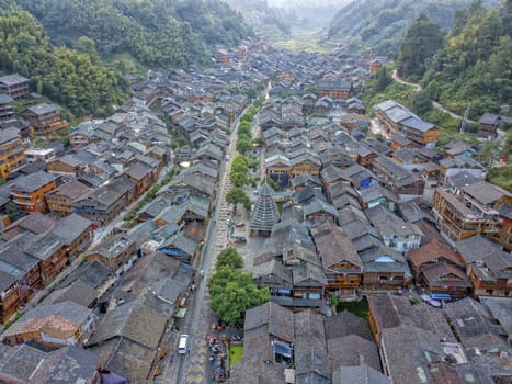 The bird's eye view of the traditional Dong village of Zhaoxing in Guizhou, China. The Chinese character in the photo is the name of Dong Village.