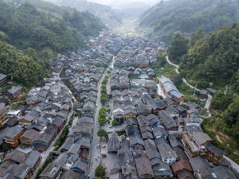 The bird's eye view of the traditional Dong village of Zhaoxing in Guizhou, China. The Chinese character in the photo is the name of Dong Village.