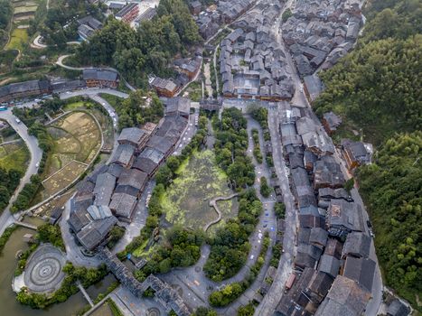 The bird's eye view of the traditional Dong village of Zhaoxing in Guizhou, China. The Chinese character in the photo is the name of Dong Village.