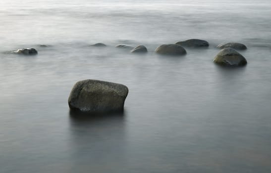 Stones in the Water at Evening Sun, Long time Exposure