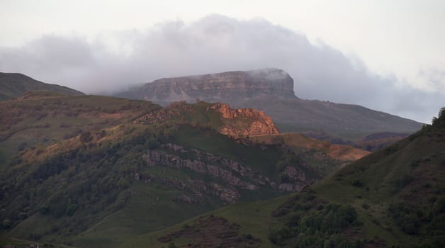 Summer Landscape Mountain Range Shrouded in a Cloud of Fog.