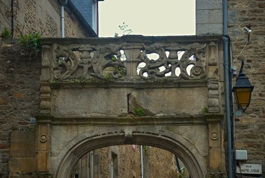 Stone archway on entrance into narrow street