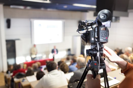 Business Conference and Presentation. Audience at the conference hall. Television broadcasted press conference.