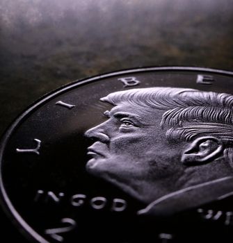 Donald Trump face on a coin macro shot