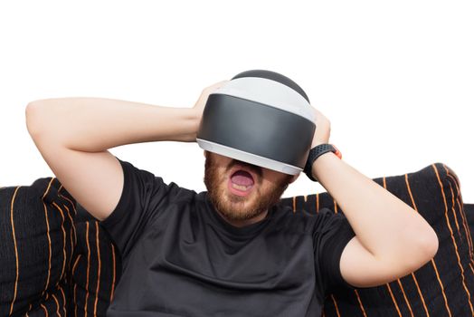 Bearded man wearing virtual reality goggles on white isolated background