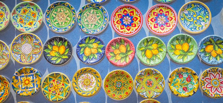 Souvenir from Sicily: fridge magnets with colourful design. Useful for background.