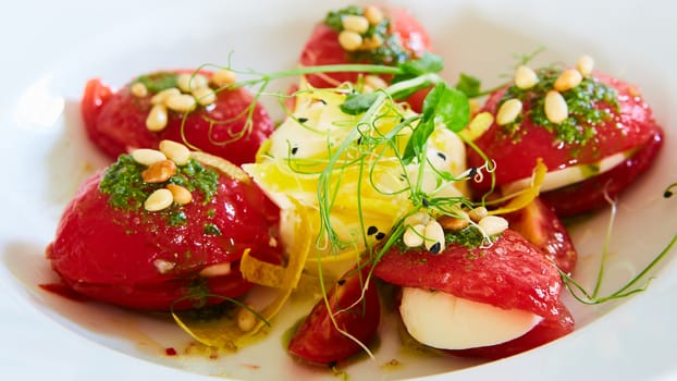 Mozzarella and tomato salad - caprese on the white plate. Shallow dof.