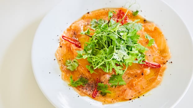 Top view of salmon carpaccio. Shallow dof