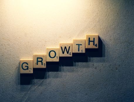 Close up of the word Growth composed of scrabble letters