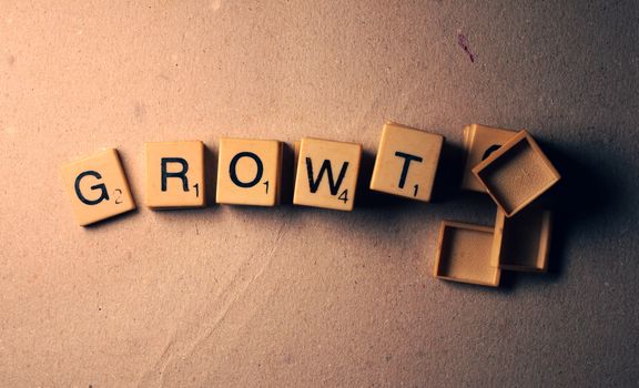 Growth tag label composed in scrabble letters