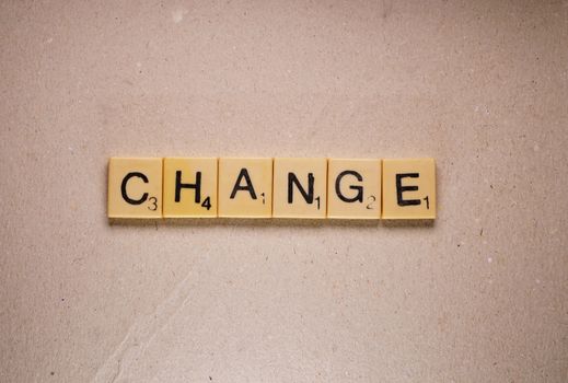 The Change label composed from scrabble letters