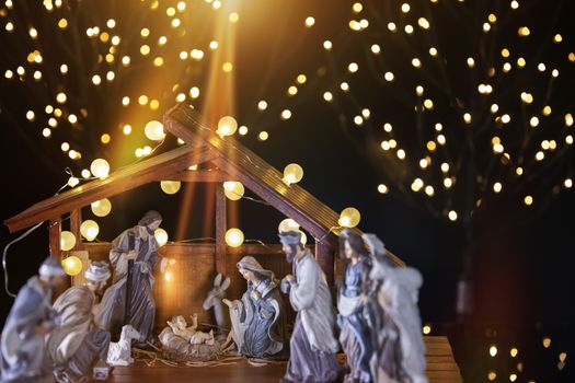 Christmas Manger scene with figurines including Jesus, Mary, Joseph, sheep and wise men. Focus on Mary!