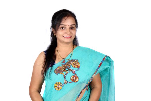 A beautiful middle aged Smiling Indian woman, on white studio background.