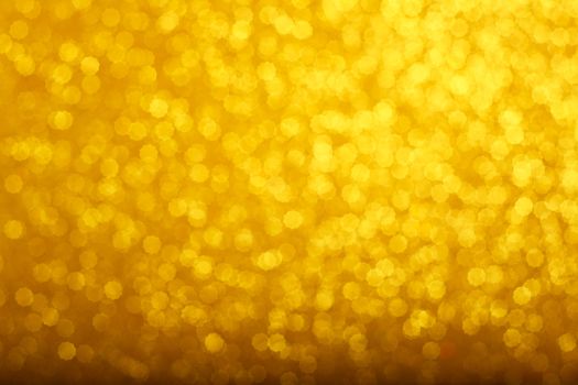 Abstract gold bokeh background of glowing lights, party, holiday, christmas