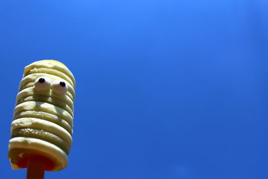 The picture shows a funny ice cream and the blue sky.