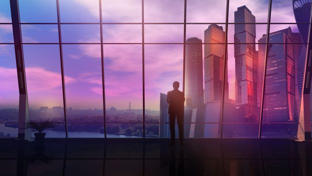 In the office with panoramic windows, a businessman looks at the landscape with skyscrapers at sunset.