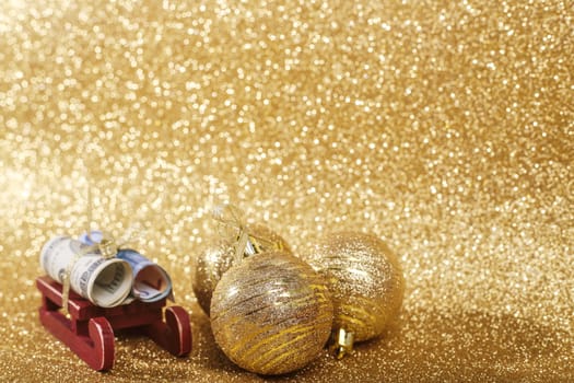 Christmas money gift on abstract gold glitters bokeh background