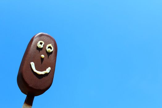 The picture shows a funny ice cream with a face.