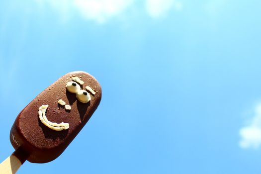 The picture shows a funny ice cream with a face.