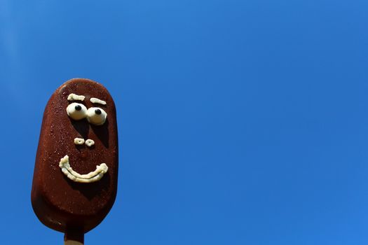 The picture shoows funny ice cream with a face.