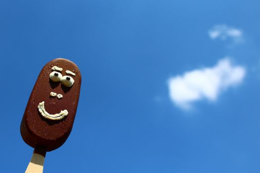The picture shows a funny ice cream with a face.