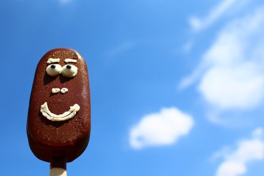 The picture shows a funny ice cream with a face.