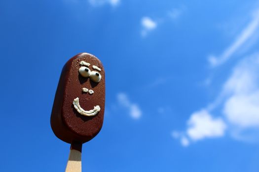 The picture shows a funny ice cream with a face.