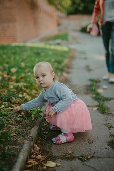 Adorable girl having fun on beautiful autumn day. authentic childhood image