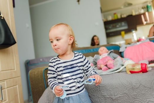 Portrait of adorable baby girl. Childhood. Authentic image