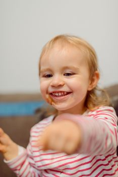 Portrait of adorable baby girl. Childhood. Authentic image