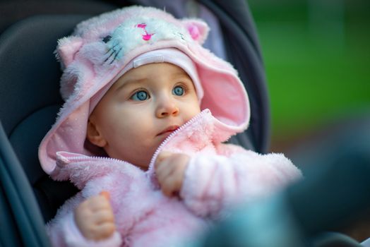 Portrait of adorable baby girl. Childhood. Authentic image