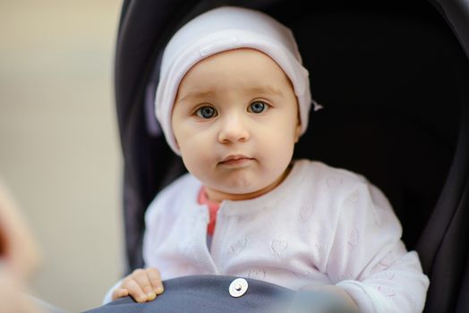 Portrait of adorable baby girl. Childhood. Authentic image