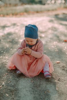 Adorable girl having fun on beautiful autumn day. authentic childhood image