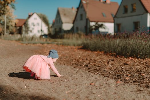 Adorable girl having fun on beautiful autumn day. authentic childhood image