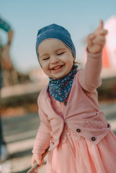 Adorable girl having fun on beautiful autumn day. authentic childhood image