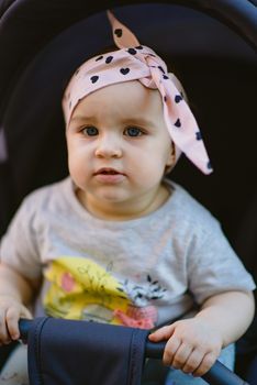 Portrait of adorable baby girl. Childhood. Authentic image