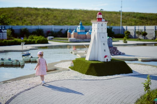 Little girl spending fantastic time on playground. Happy childhood. Authentic image