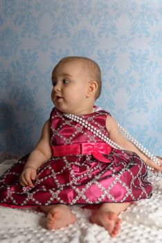Portrait of adorable baby girl. Childhood. Authentic image