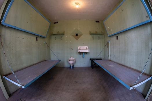 Low angle view of uncomfortable prison beds