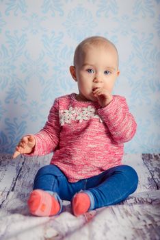 Portrait of adorable baby girl. Childhood. Authentic image