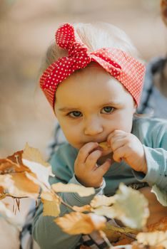 Adorable girl having fun on beautiful autumn day. authentic childhood image